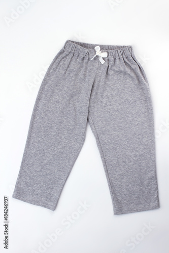 Plain gray pajama pants with white drawstring. Cozy melange cotton. Sleepwear bottom for boys.