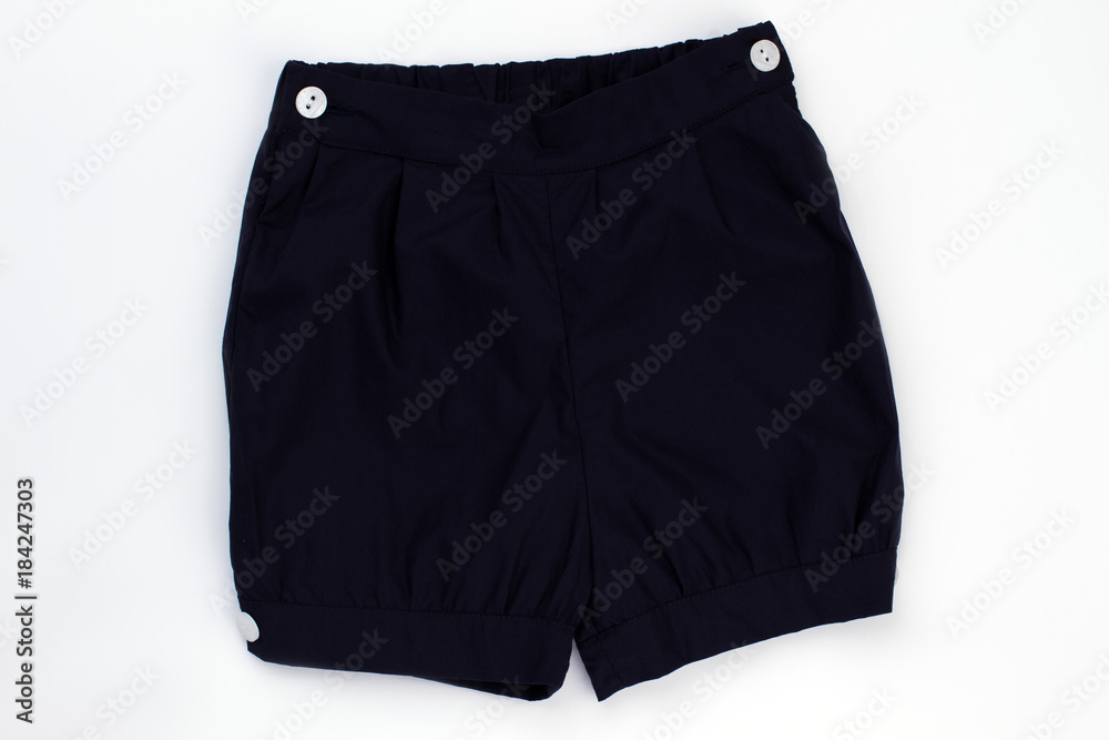 Black shorts with white buttons. Bottom garment for comfortable night rest. Kids clothing item. Black shorts with white buttons. Bottom garment for comfortable night rest. Kids clothing item.