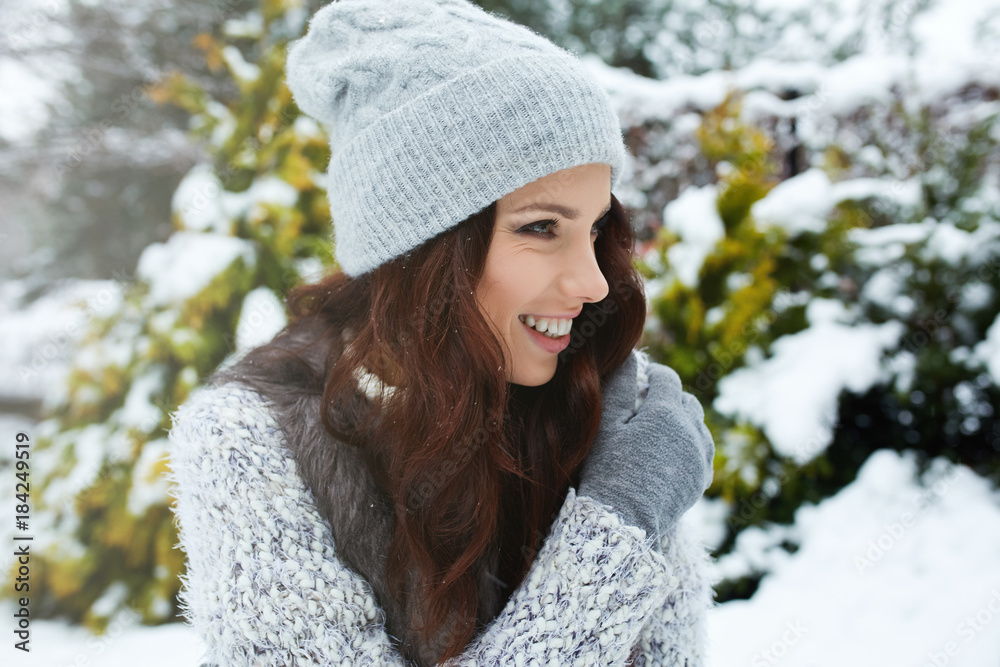 beautiful smiling young woman in wintertime outdoor. Winter concept beautiful smiling young woman in wintertime outdoor. Winter concept
