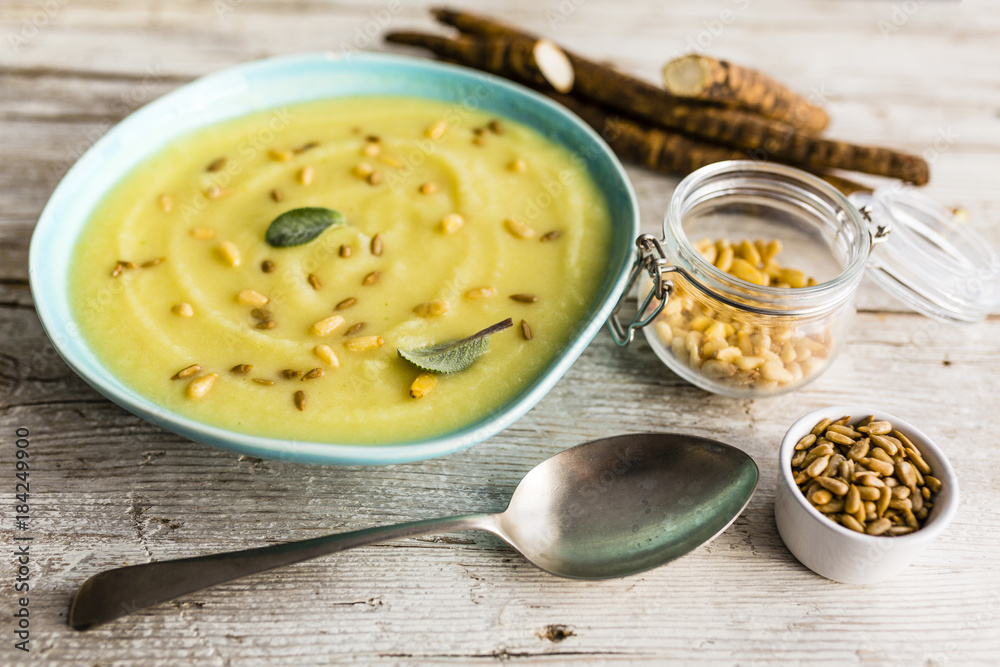 Delicious scorzonera cream soup with pine nuts and seeds.
Delicious scorzonera cream soup with pine nuts and seeds.