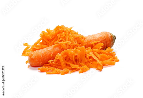 Fresh carrot and shavings isolated on white background
