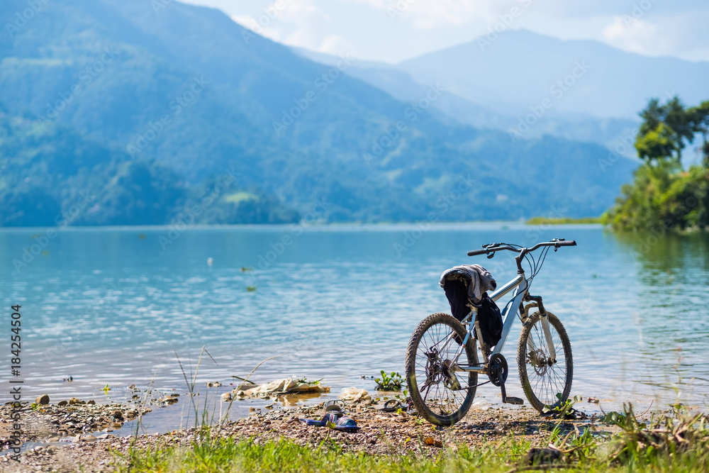 Sport bike left near shoreline, Pokhara, Nepal