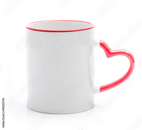 Foto White cup with red rim and handle in heart shape isolated on a white background