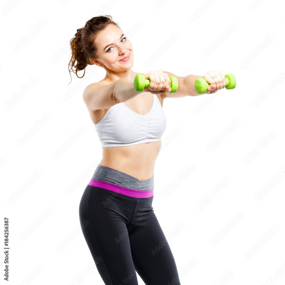 Young sporty woman doing exercises with dumbbells isolated on white background