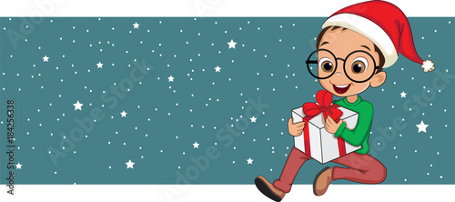 Cute little boy holding Christmas present