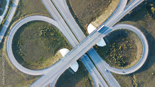 Aerial shot of highway junction with cars top view in the form of a sign of infinity