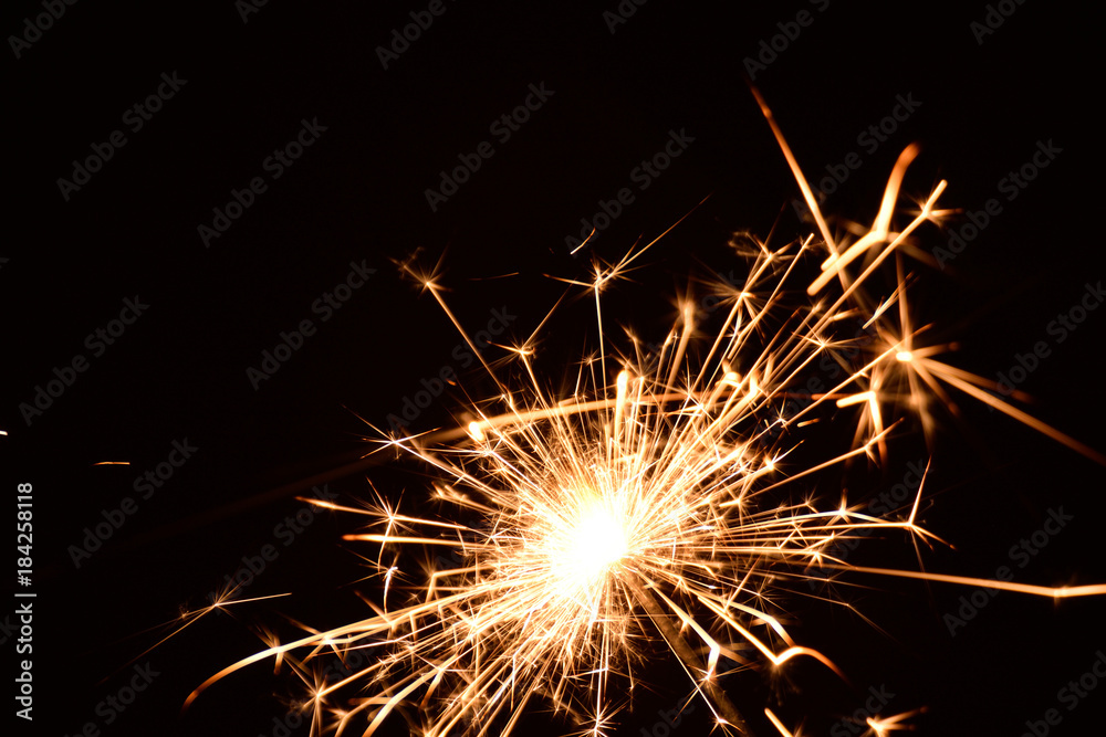 Blank background with bengal fire .Sparkler . New year party sparkler on black background