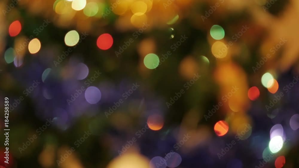 Christmas Balls on Christmas Tree. Christmas and New Year Decoration. Abstract Blurred Bokeh Holiday Background. Blinking Garland. Christmas Balls on Christmas Tree. Christmas and New Year Decoration. Abstract Blurred Bokeh Holiday Background. Blinking Garland.