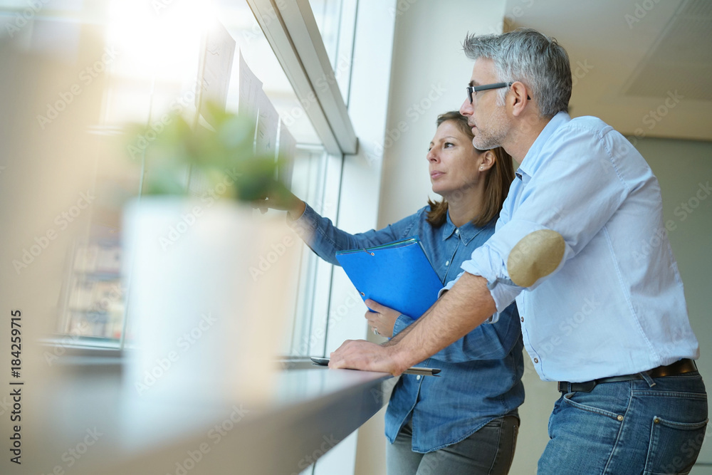 Business team analyzing sales results in charts