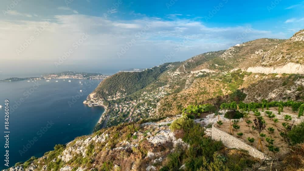 Morning timelapse view of the Mediterranean coastline of the town of Eze village on the French Riviera Morning timelapse view of the Mediterranean coastline of the town of Eze village on the French Riviera