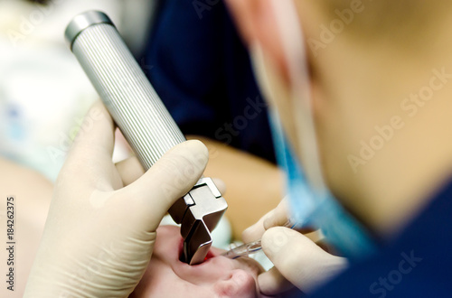 The process of intubation of the patient before the cardiac operation.