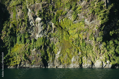 A rocky mountain rising striaght from the sea. photo