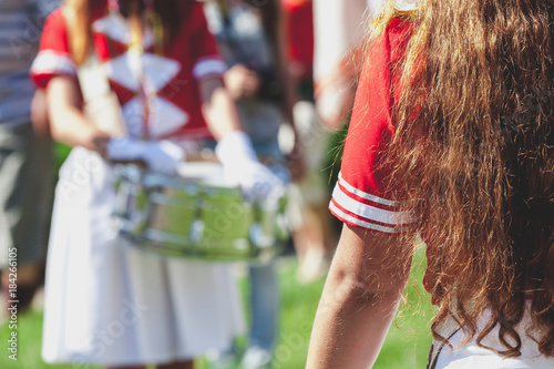 Photos Girl with long hair in red Busby