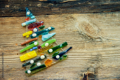 Christmas tree decorated with glass and wooden vintage toys in pastel colors