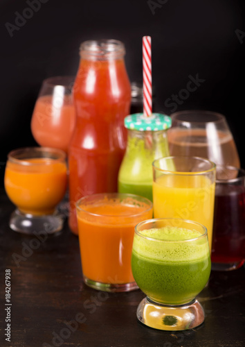 fruit and vegetable juices on a dark background