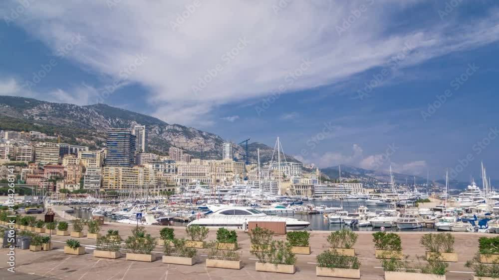 Monte Carlo Port Hercule panorama timelapse hyperlapse. View of luxury yachts and houses around harbor of Monaco, Cote d'Azur. Monte Carlo Port Hercule panorama timelapse hyperlapse. View of luxury yachts and houses around harbor of Monaco, Cote d'Azur.