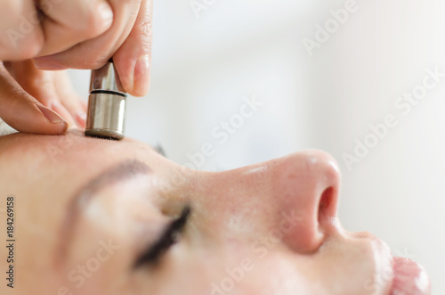 Diamond microdermabrasion skin face therapy in beauty spa photo