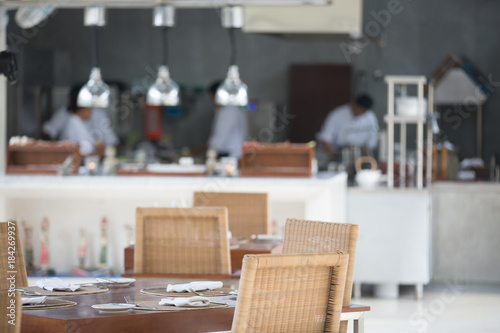 Blurry background of chef in hotel or restaurant kitchen cooking and decoration. Open kitchen