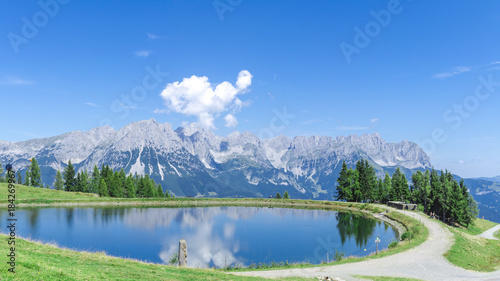 Panorama vom Wilden Kaiser in Tirol bei Sonnenschein und blauem Himmel mit Blick von den Bergen (Hartkaiser) in Ellmau photo