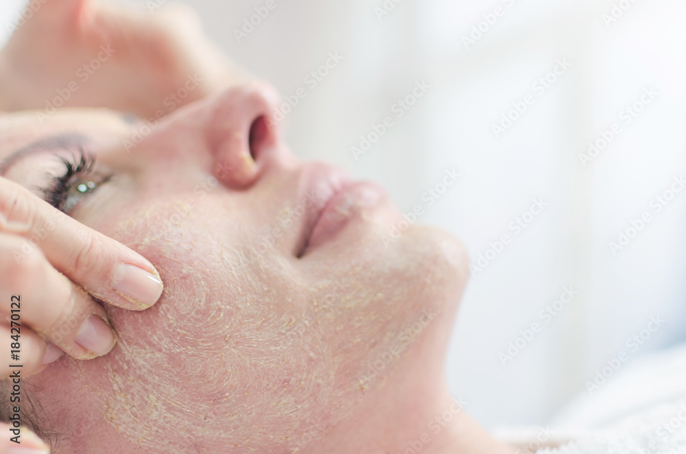 Peeling and female massage face in salon Peeling and female massage face in salon