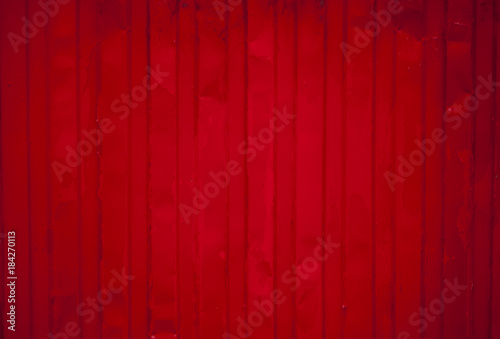 Red damaged steel wall background.