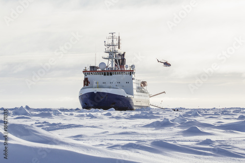 Research icebreaker and helicopter