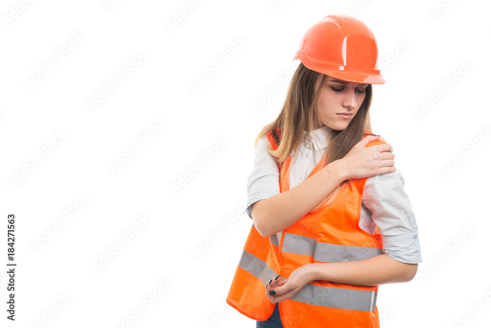 Engineer woman with hard hat got shoulder pain Engineer woman with hard hat got shoulder pain