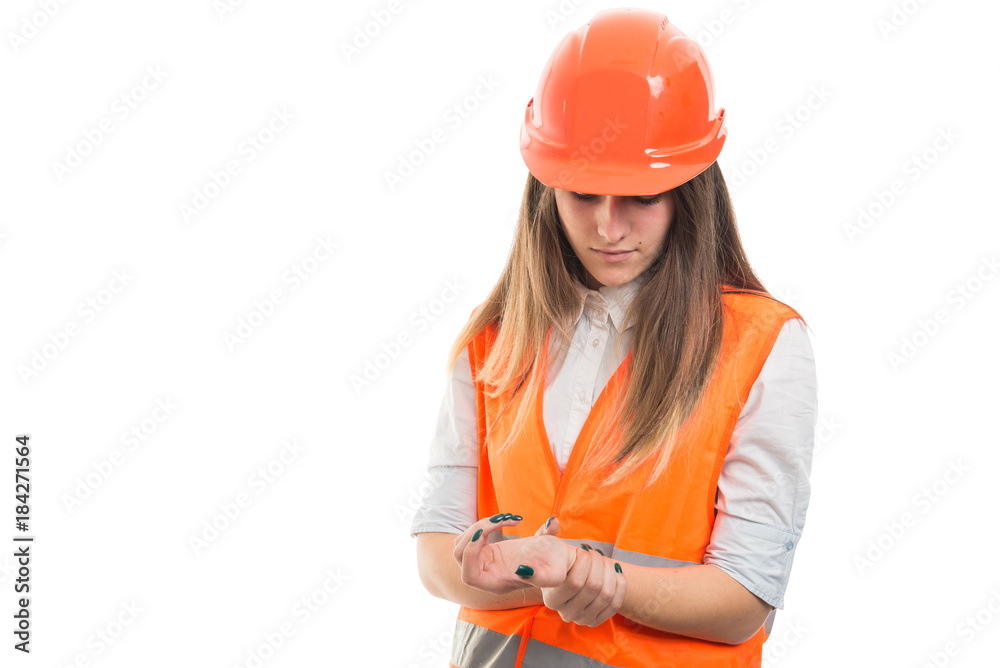 Woman architect with arthritis massaging hands in pain Woman architect with arthritis massaging hands in pain