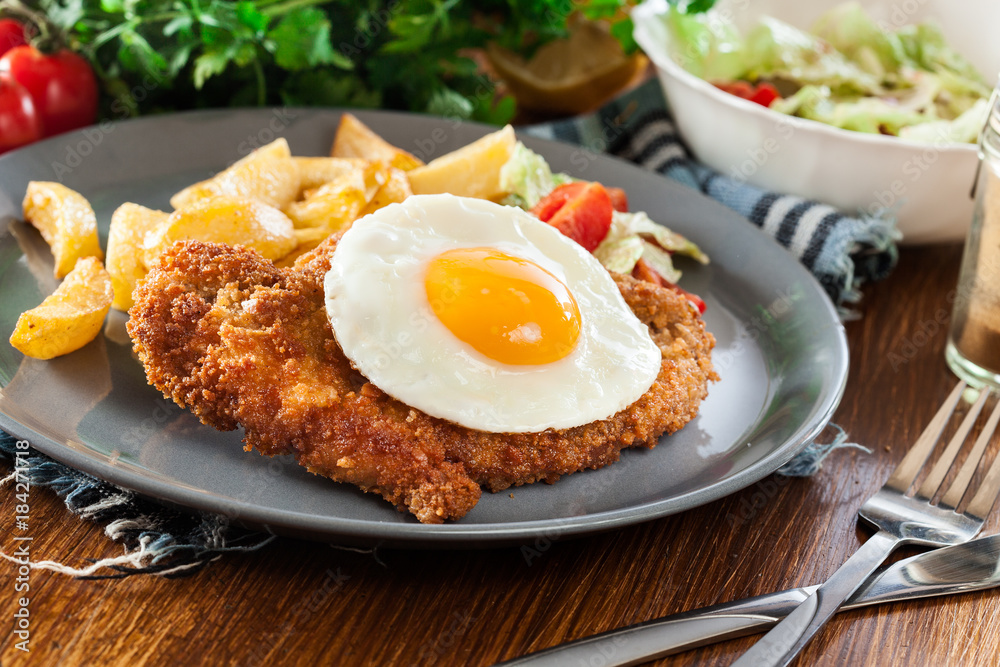 Breaded viennese schnitzel with fried agg Breaded viennese schnitzel with fried agg