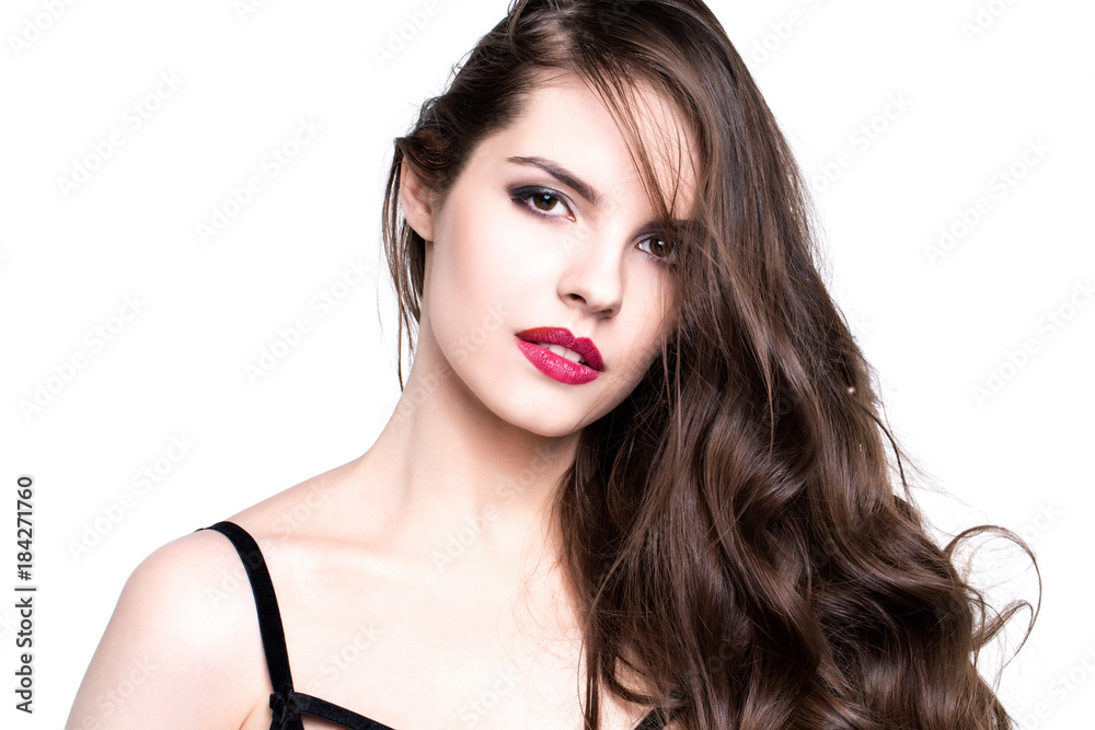 Beautiful brunette with long curly hair isolated. Beautiful brunette with long curly hair isolated.
