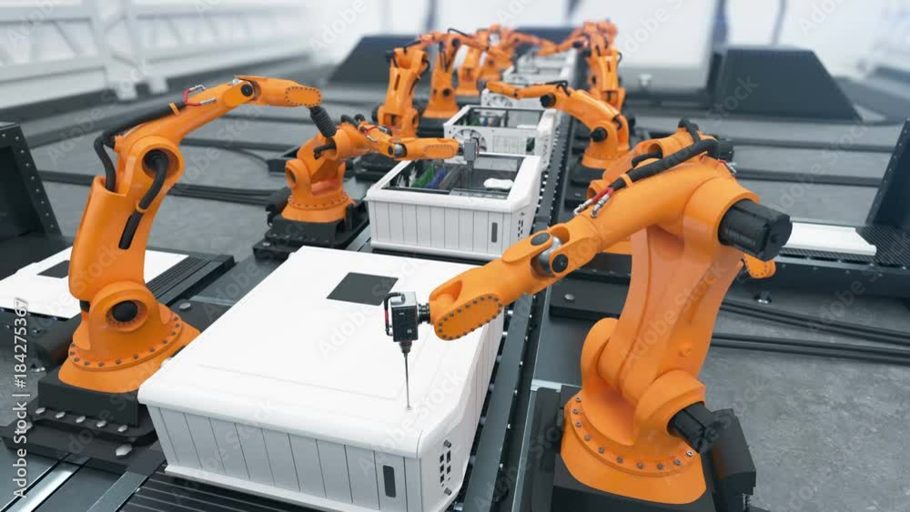 Robotic Arms Assembling Computers On Conveyor Belt Close-up. Advanced Automated Process. Looped 3d Animation. Business and Technology Concept. 4k UHD 3840x2160.