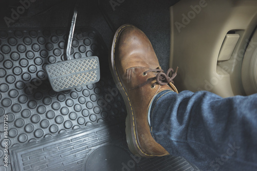 Close up Leather Shoe ob pedal in car