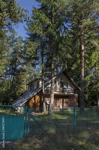 Forest house in the residential district of bulgarian village  Mala tsarkva, Rila mountain, Bulgaria  © vili45