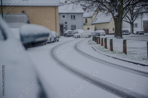 cars parked on the street covered with fresh snow, Germany , Hesse 2017