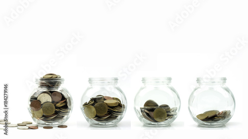 Save money and investment concept, coins growing up in glass isolated on white background .