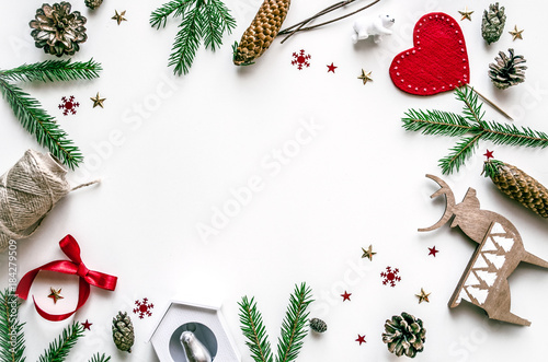 Christmas frame made from fir branches and Christmas toys. Preparation for the New Year. Christmas background for presentation of work or text. Copy space. Top view