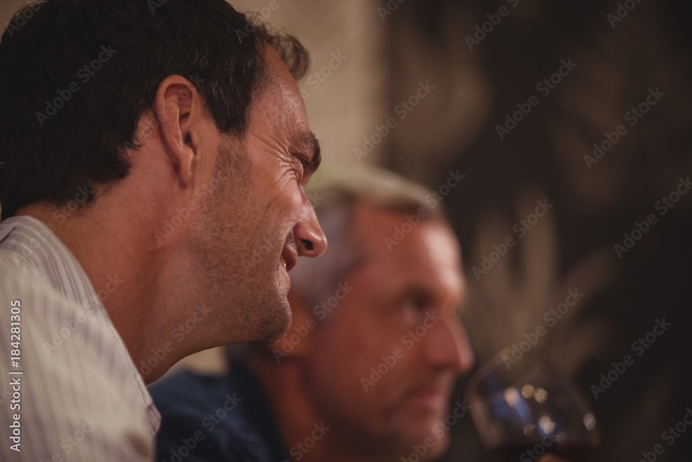 Man smiling while having meal Man smiling while having meal