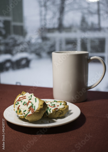 Coffe and Biscotti in Front of Window on Snowy Day