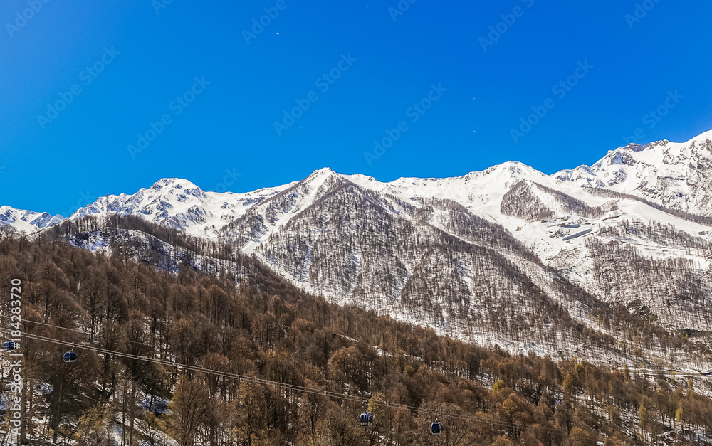 Landscape with the mountains and ski slopes of  the ski area of Rosa Khutor, Krasnaya Polyana, Sochi, Russia.