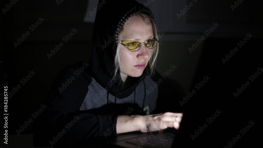 Woman hacker with laptop. Hacker attack, virus. Woman hacker with laptop. Hacker attack, virus.