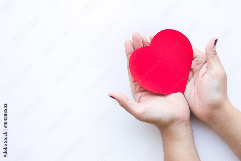 Female with red paper heart shape on white background.love,.valentine,wedding concepts Female with red paper heart shape on white background.love,.valentine,wedding concepts