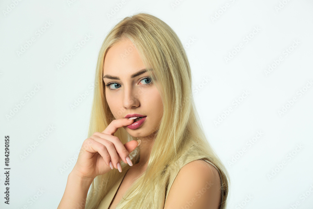beautiful young modern girl on a white background with a thoughtful expression on her face beautiful young modern girl on a white background with a thoughtful expression on her face