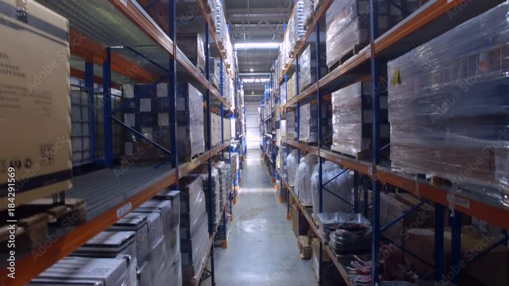 A huge warehouse facility with stretch wrapped pallets. A huge warehouse facility with stretch wrapped pallets.