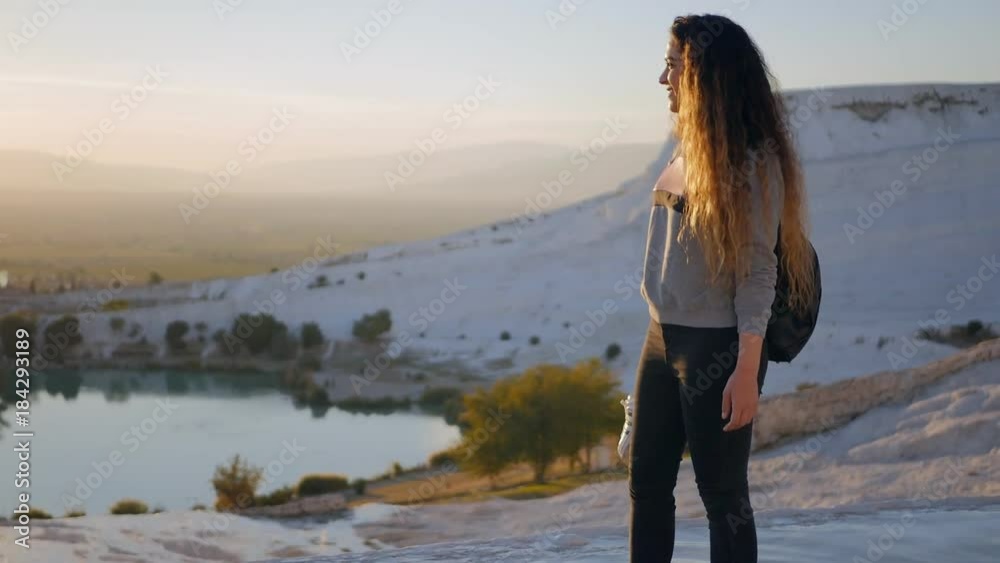 Young woman walking in Pamukkale terraces