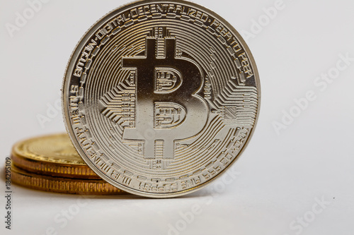 Silver bitcoins on a white background