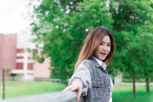 Portrait of Beautiful thai student,Cute asian girl outdoors,thailand people,Hobbie of modern student,lifestyle of single woman © reewungjunerr