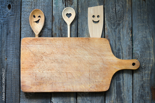 Old retro vitnage empty cutting board fun food concept background with spoon
