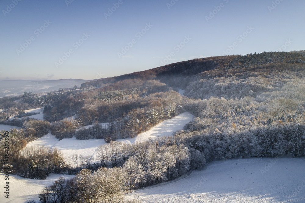 Aerial winterwonderland view with drone of snowy forest in Lower Austria Aerial winterwonderland view with drone of snowy forest in Lower Austria
