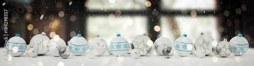 White and blue christmas baubles lined up 3D rendering