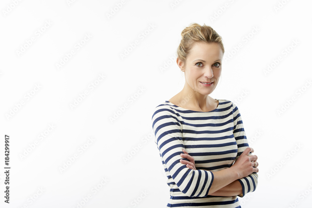 Confident mature woman standing against white isolated background Confident mature woman standing against white isolated background